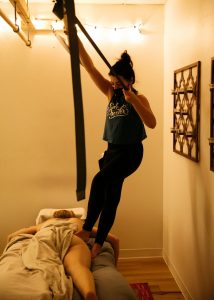Myofascial Deep Tissue Massage by popular Colorado Springs massage therapy, Camino Massage: image of a woman standing on a person's body. 
